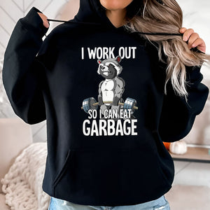 Black hoodie with humorous workout apparel featuring muscular raccoon lifting weights and funny text