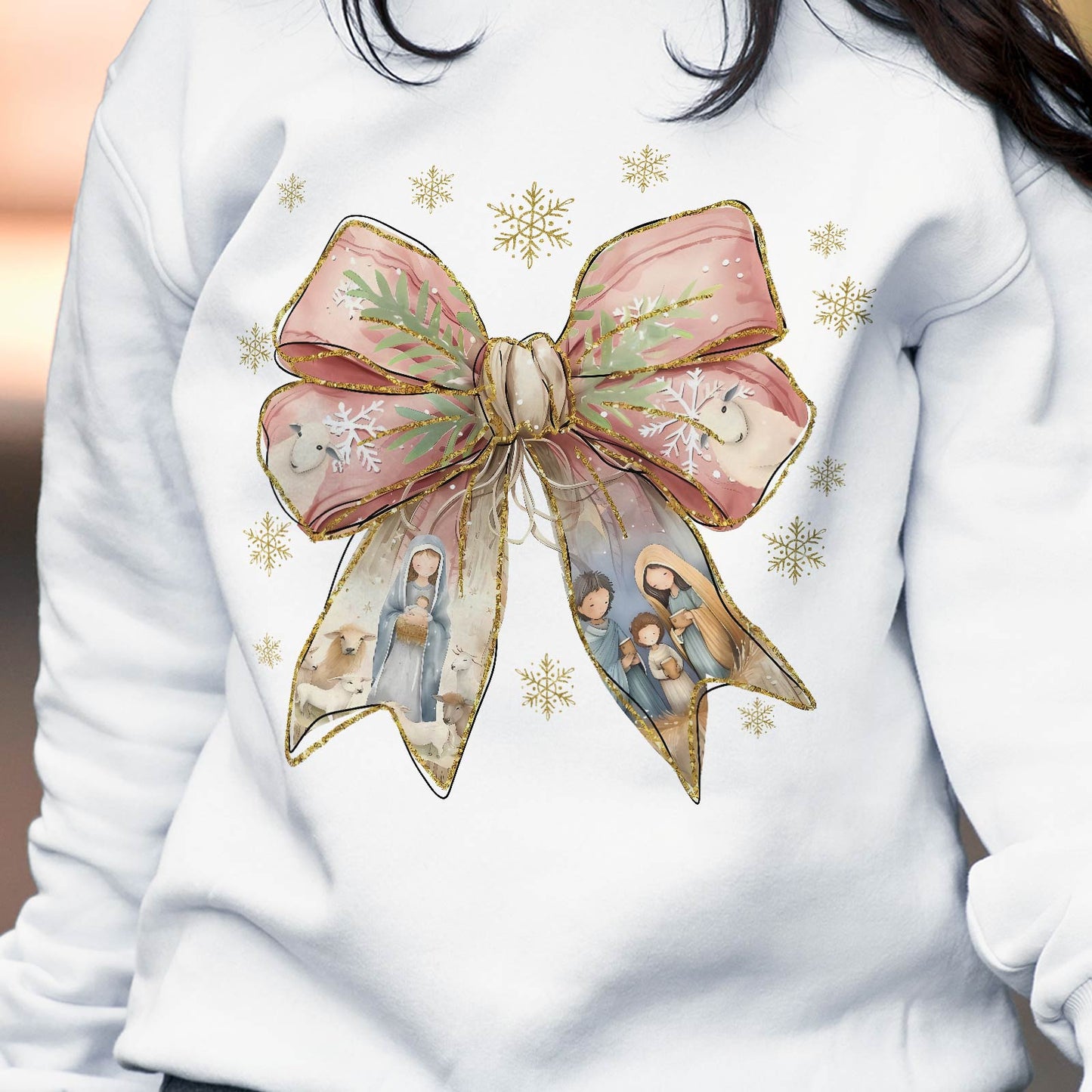 White Jesus Christmas bow shirt with large pink bow and nativity scene featuring Mary, Joseph, baby Jesus, and animals