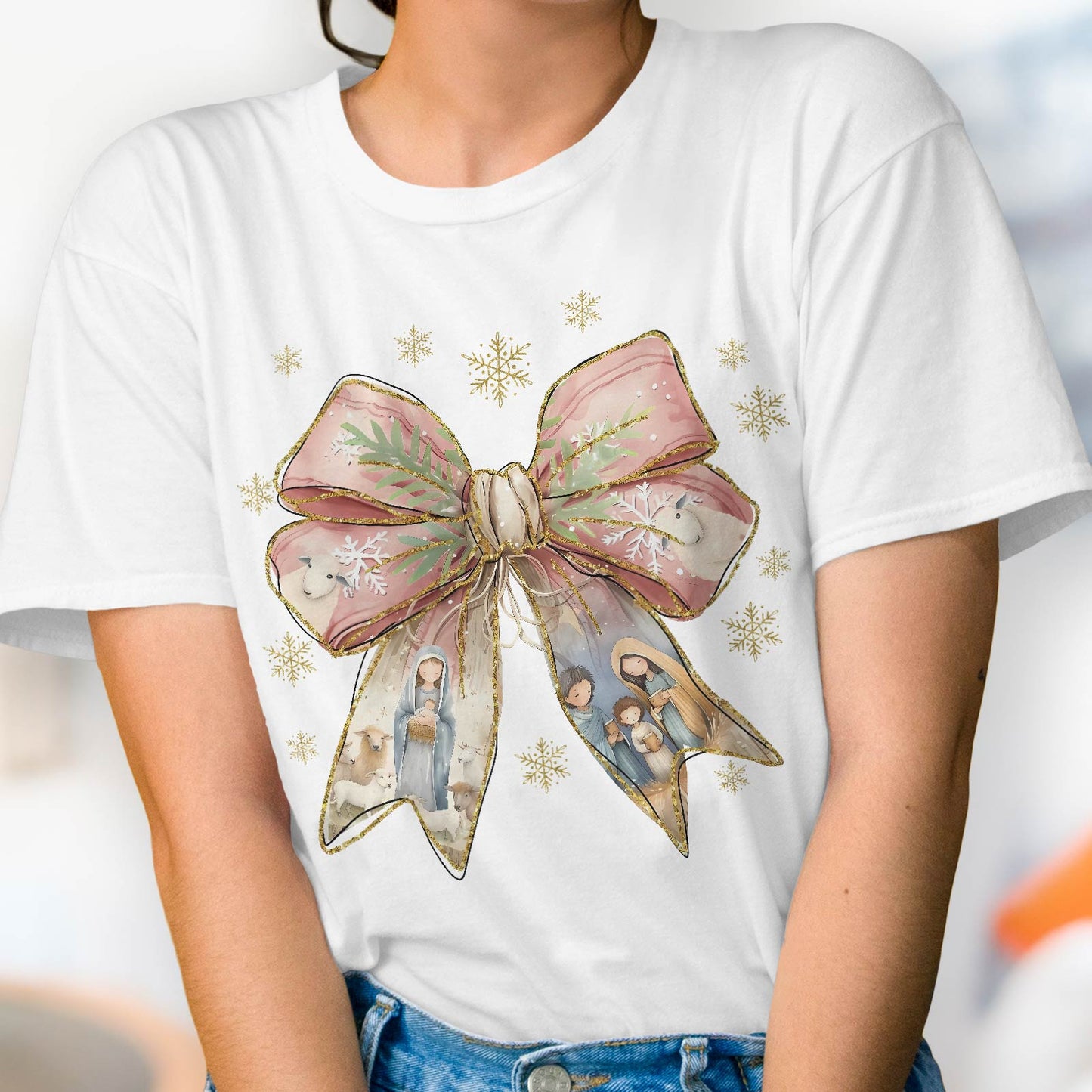 White Jesus Christmas bow shirt featuring a large bow with nativity scenes and gold snowflakes