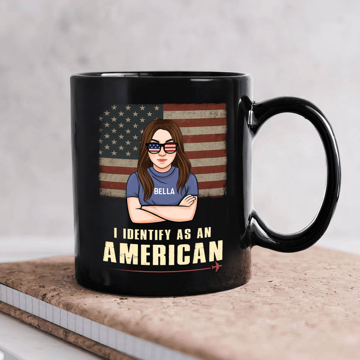 365Gifty custom I identify as an American mug. Black ceramic mug with cartoon woman in flag sunglasses and Bella name