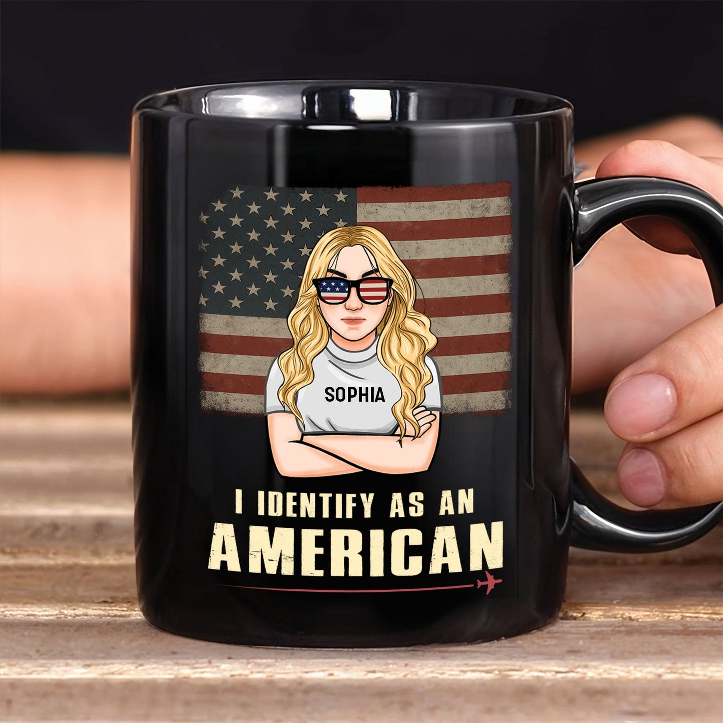 Black ceramic custom I identify as an American mug showing blonde woman with flag sunglasses and vintage US flag background