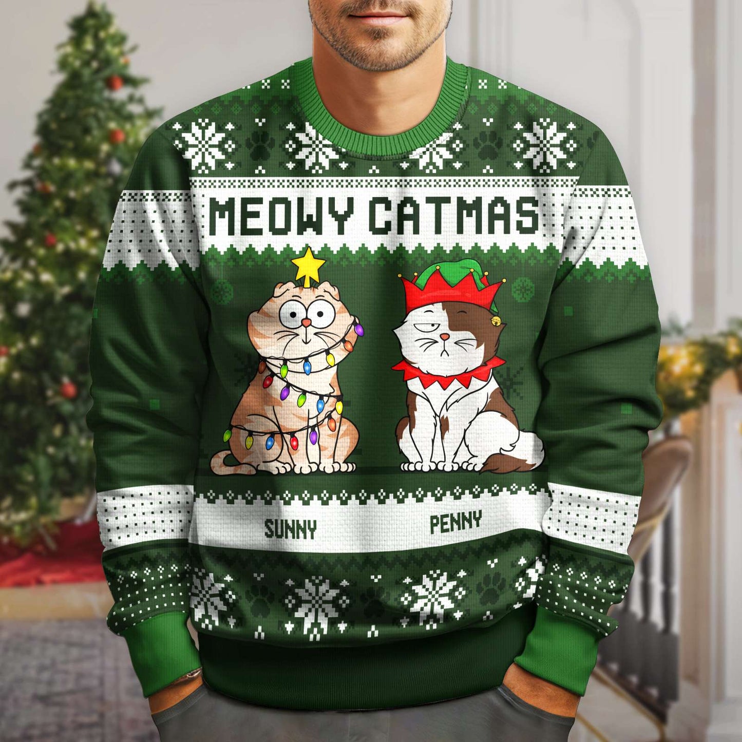 Green meowy catmas holiday sweatshirt featuring two cartoon cats decorated for Christmas with festive patterns