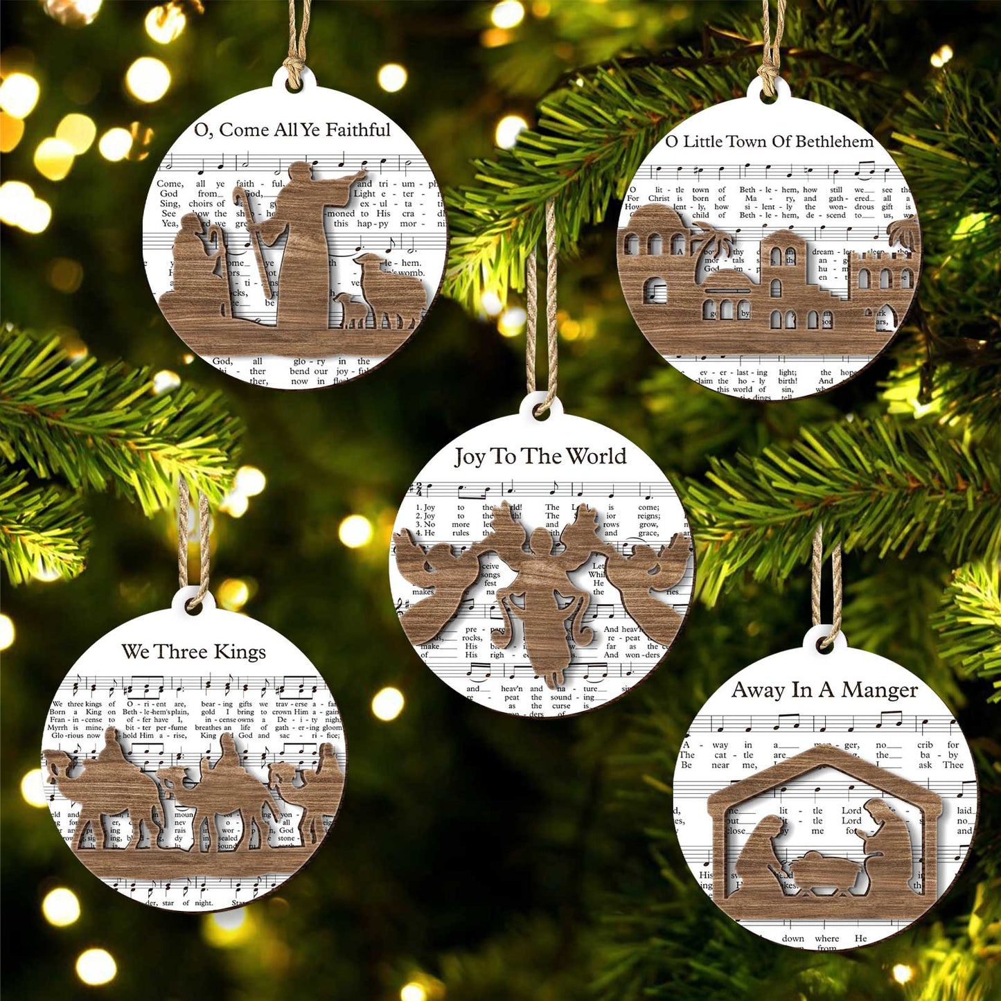 365Gifty music sheet nativity ornament set with wooden nativity and holiday song designs hanging on Christmas tree
