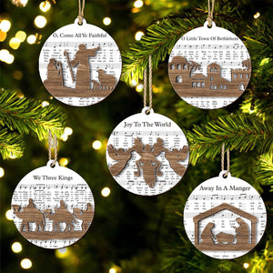 365Gifty music sheet nativity ornament set with wooden nativity and holiday song designs hanging on Christmas tree
