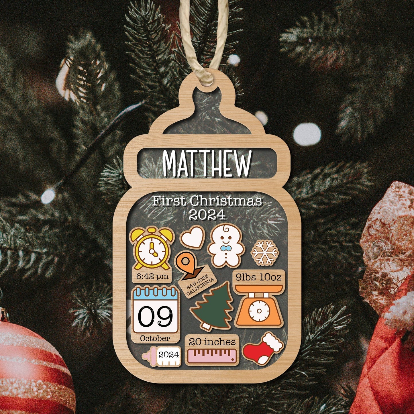 Personalized baby first Christmas ornament with name Matthew and birth details in wood bottle shape