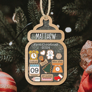 Personalized baby first Christmas ornament with name Matthew and birth details in wood bottle shape