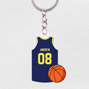 Personalized basketball jersey keychain featuring a blue jersey with name and number and a basketball