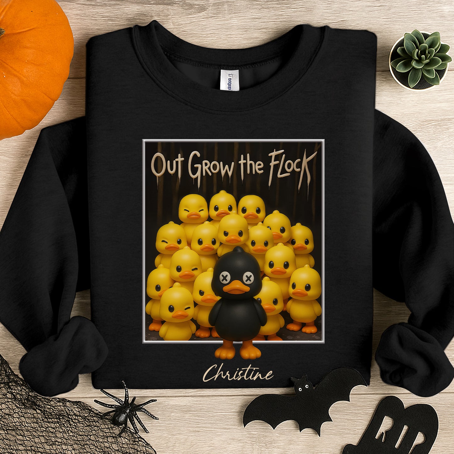 Personalized black duck shirt with black duck standing out among yellow ducks and text Out Grow the Flock