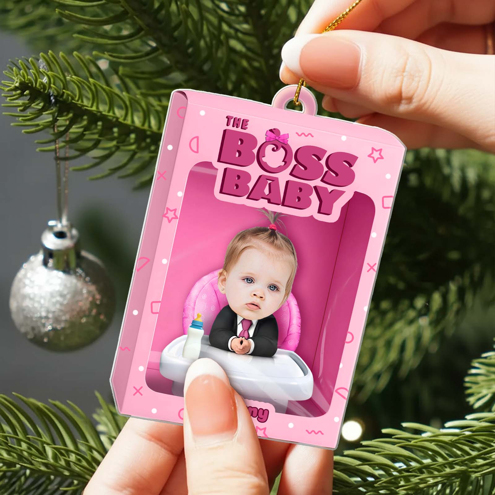 Personalized boss baby ornament featuring a cute baby in a suit on a tree branch