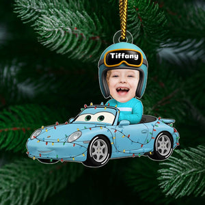 Personalized car Christmas ornament featuring a smiling child with a helmet in a decorated blue car