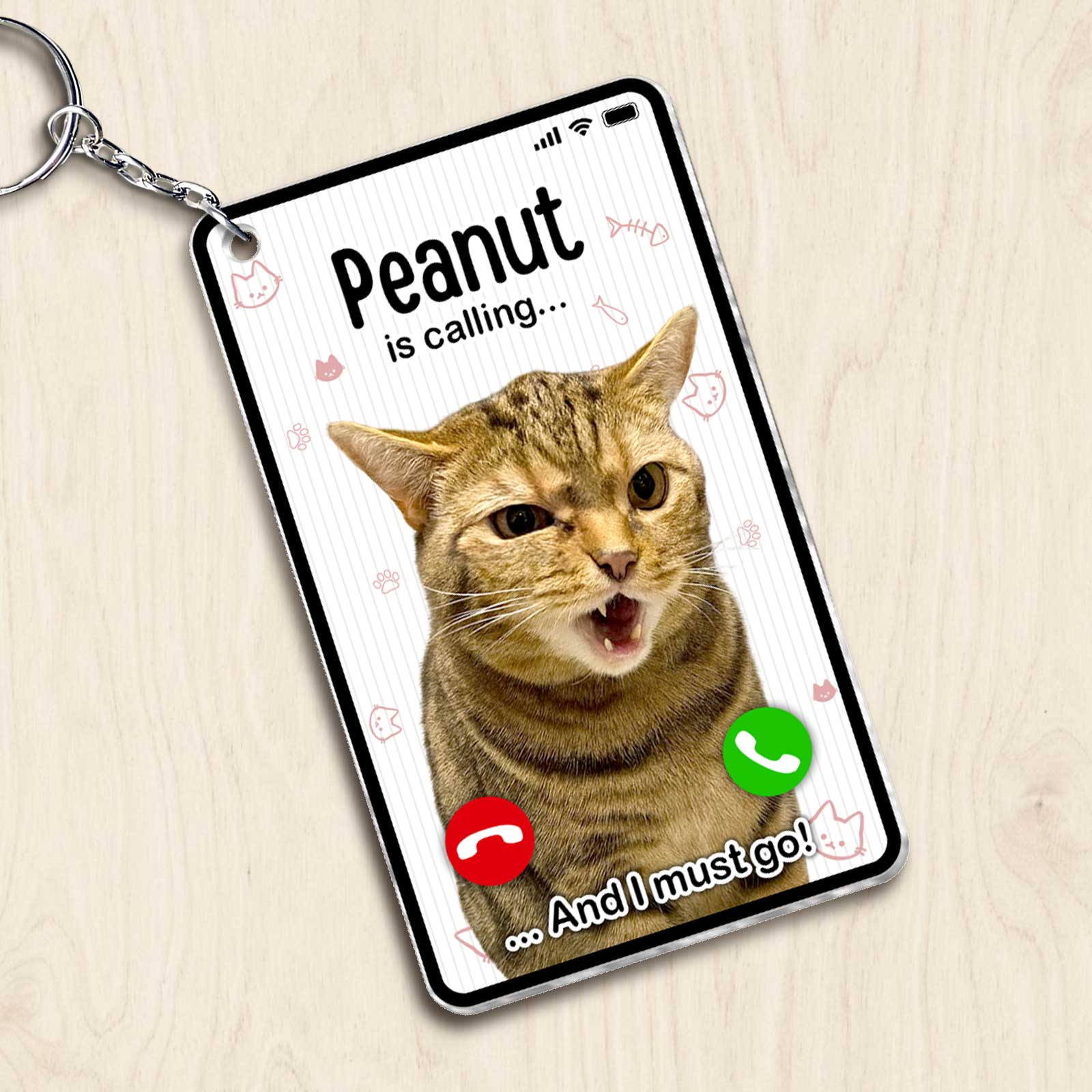 Personalized cat photo keychain featuring a cat with a playful expression and phone call design