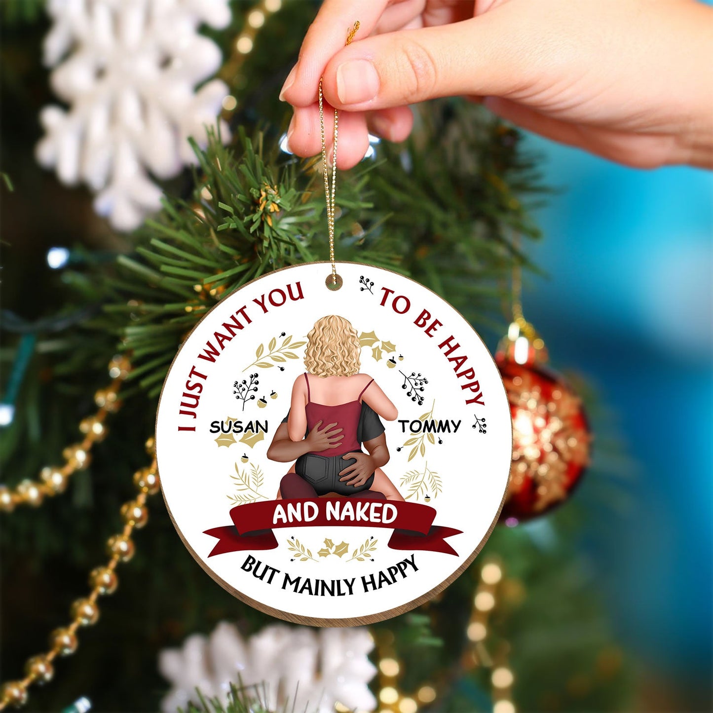 Personalized Christmas couple ornament with names Susan and Tommy hanging on a tree