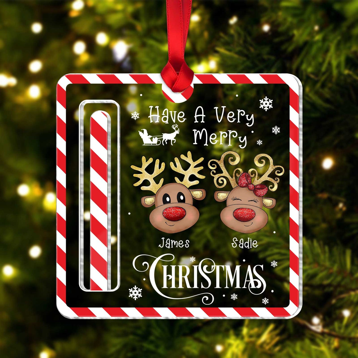 Personalized Christmas money holder with reindeer faces and names James and Sadie hanging on tree