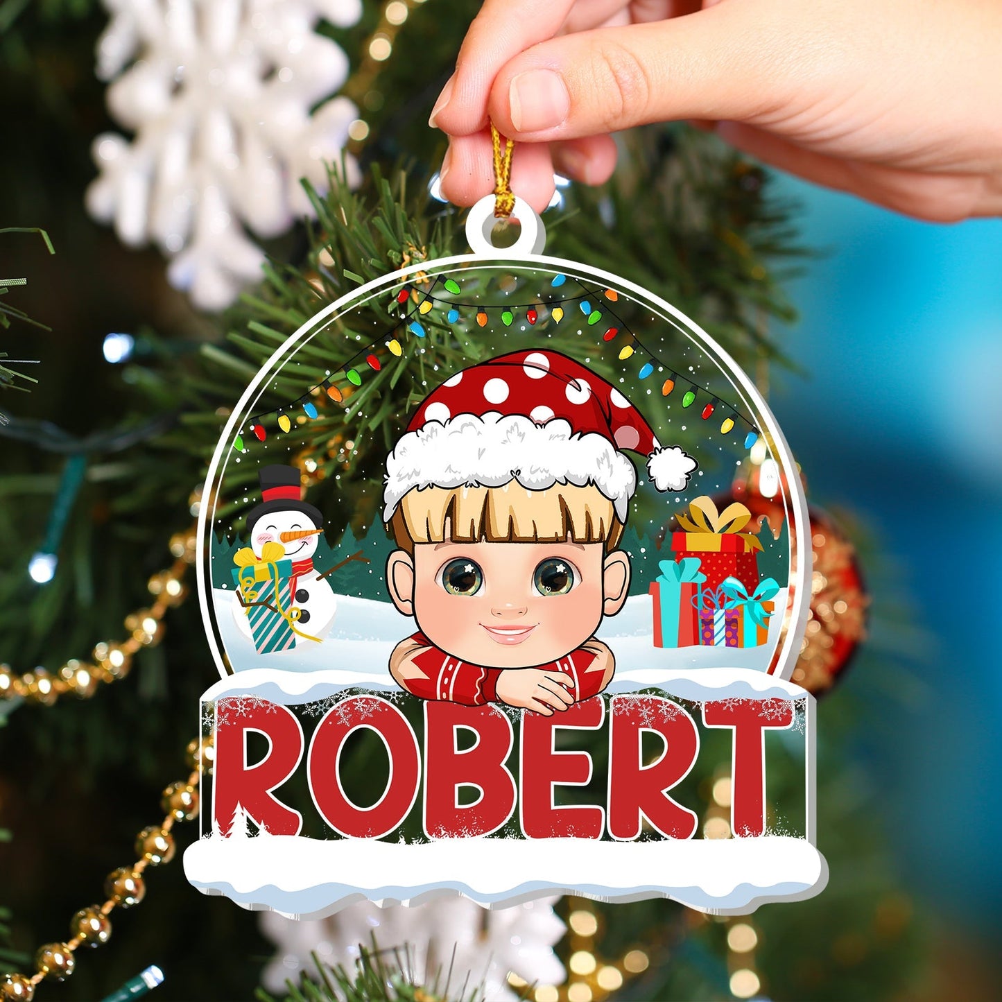Personalized Christmas ornament for kids with cartoon boy in Santa hat and name Robert hanging on tree