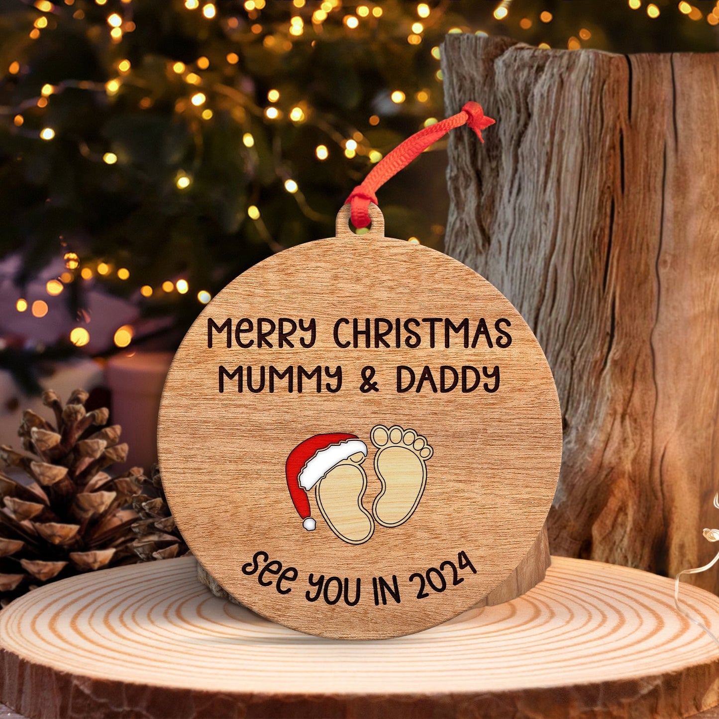 Personalized Christmas ornament for parents with Merry Christmas message and baby footprints design
