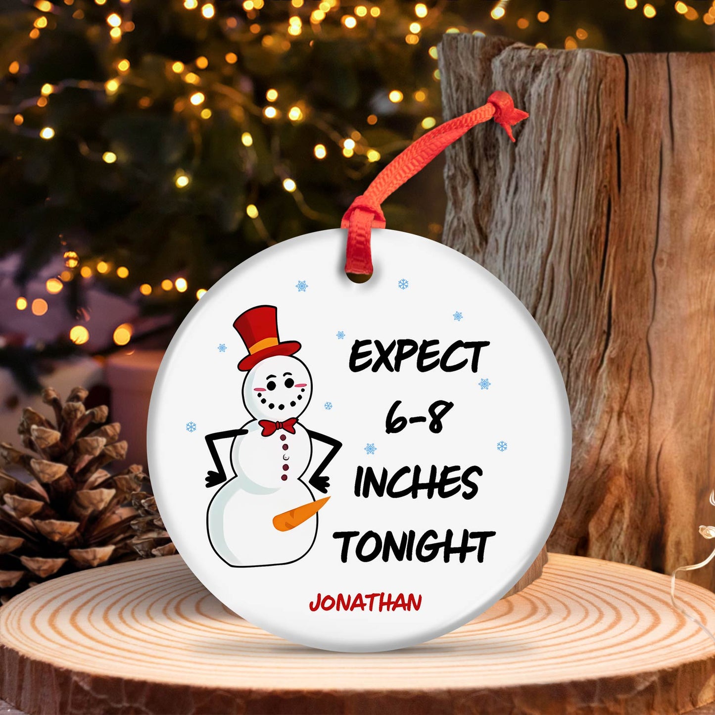 Personalized Christmas ornament with snowman design and custom name Jonathan hanging on red ribbon