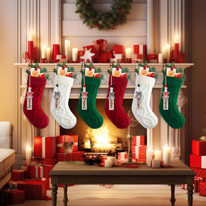 Festive personalized Christmas stockings in red, white, and green hanging on a mantel above a cozy fireplace