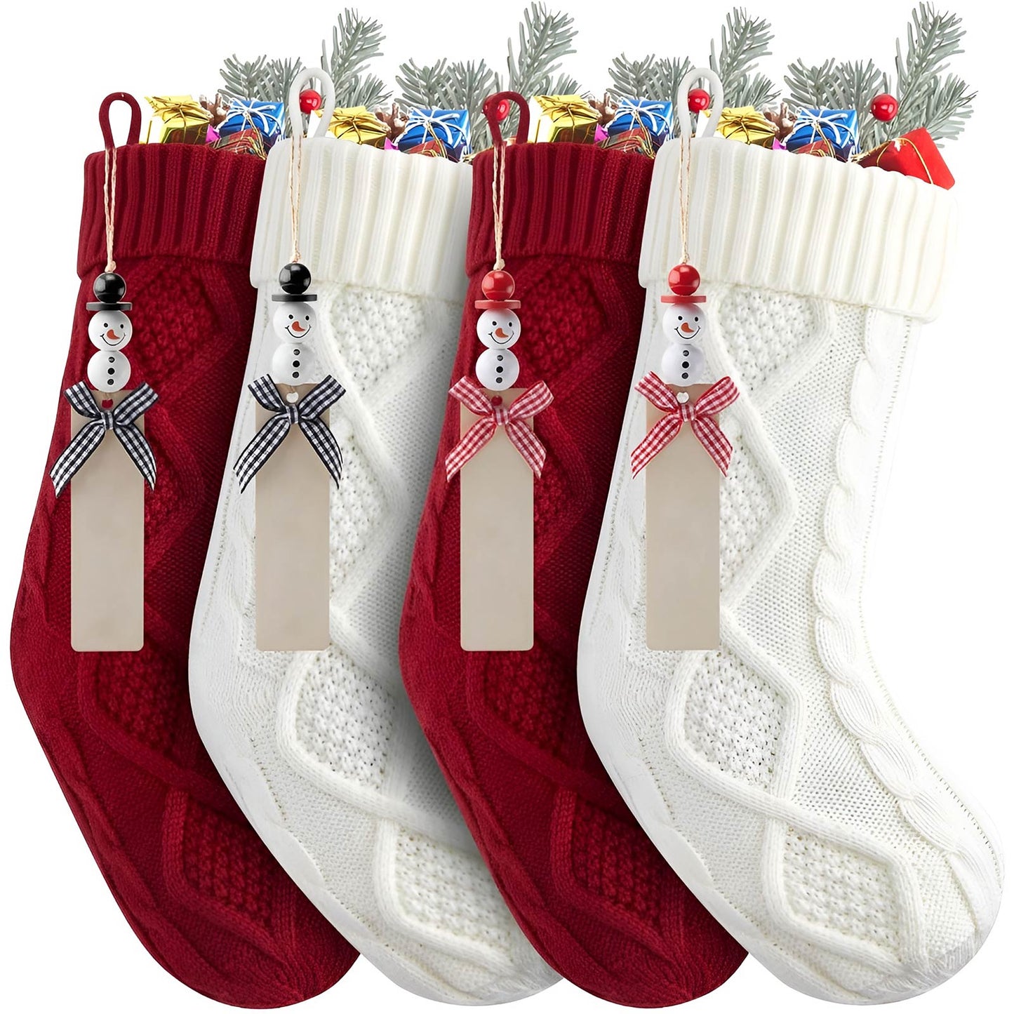 Set of red and white personalized Christmas stockings with snowman tags and assorted holiday gifts inside