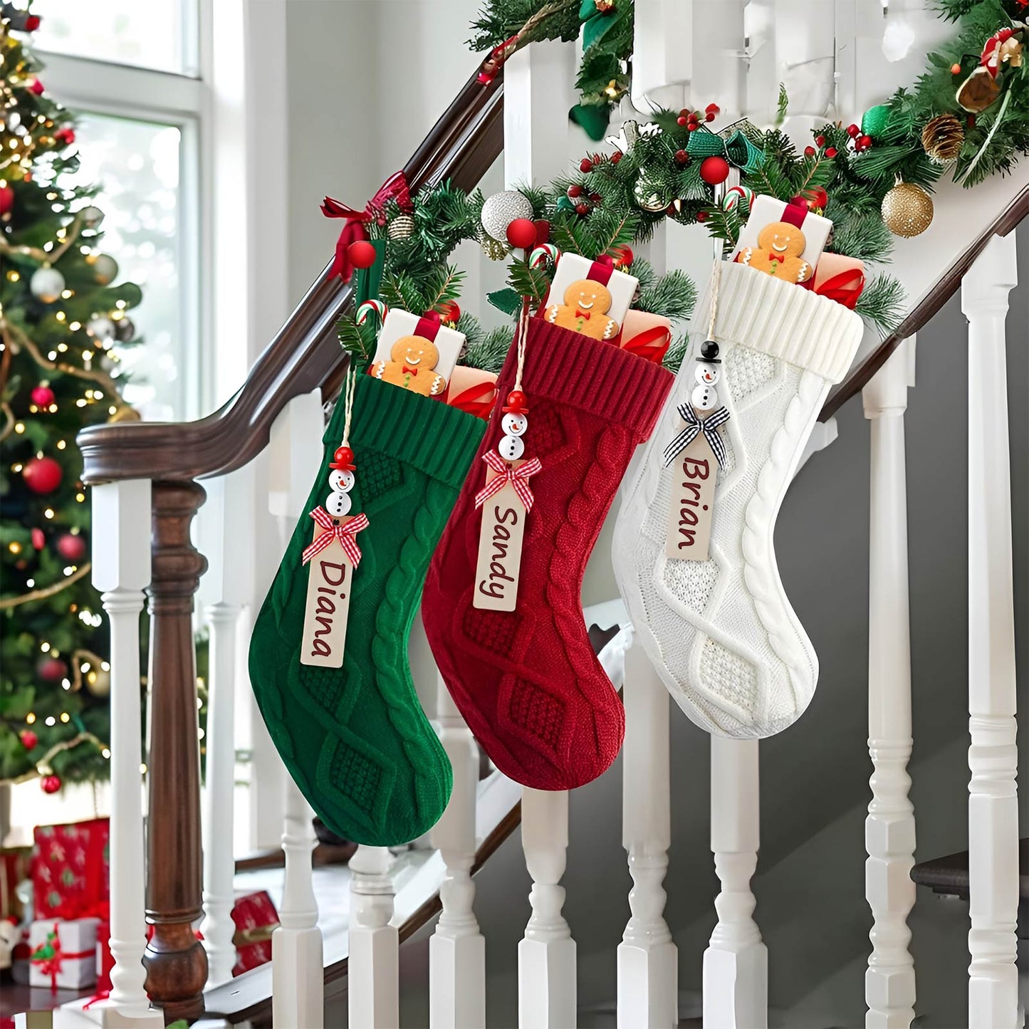 Personalized Christmas stockings in green red and white hanging on staircase with candy and gingerbread decorations