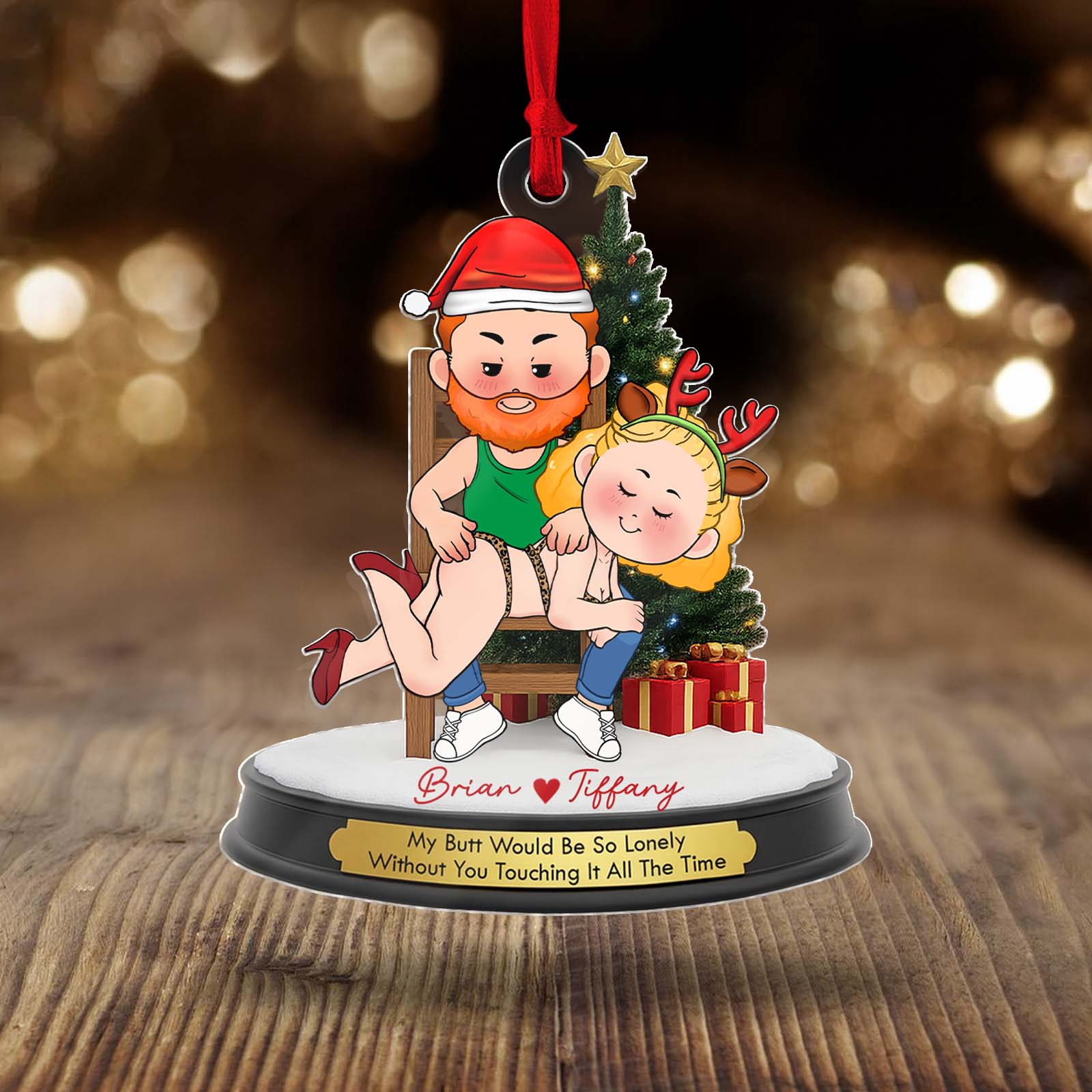 Personalized couple Christmas ornament featuring a cartoon couple with festive attire and playful message