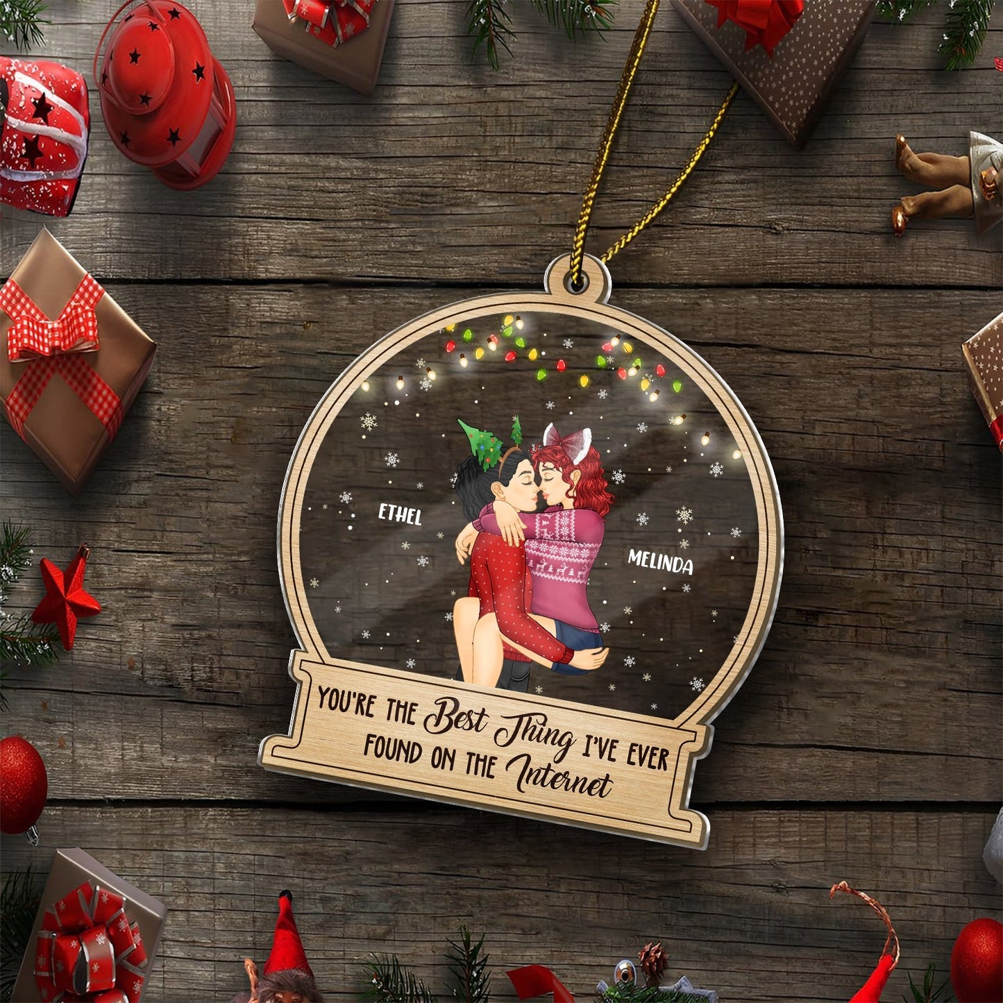 Personalized couple Christmas ornament with illustration of couple hugging and festive lights by 365Gifty