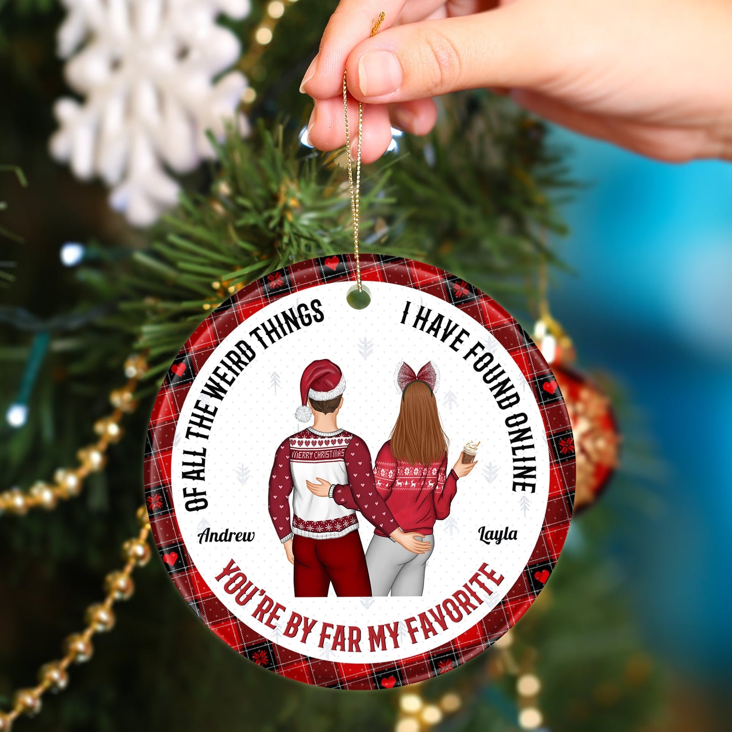 Personalized couple Christmas ornament with festive sweaters and names Andrew and Layla hanging on tree