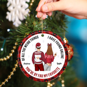 Personalized couple Christmas ornament with festive sweaters and names Andrew and Layla hanging on tree