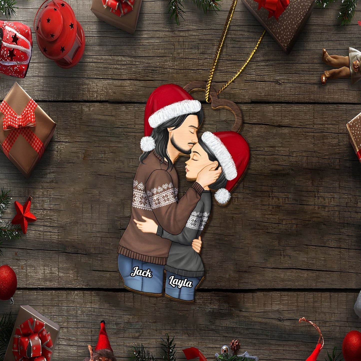 Personalized couple Christmas ornament featuring a kissing couple wearing Santa hats and cozy sweaters with names Jack and Layla