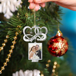Personalized couple Christmas ornament featuring a photo frame for cherished memories