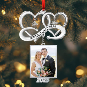 Personalized couple Christmas ornament featuring intertwined hearts and a photo frame for 2023 memories
