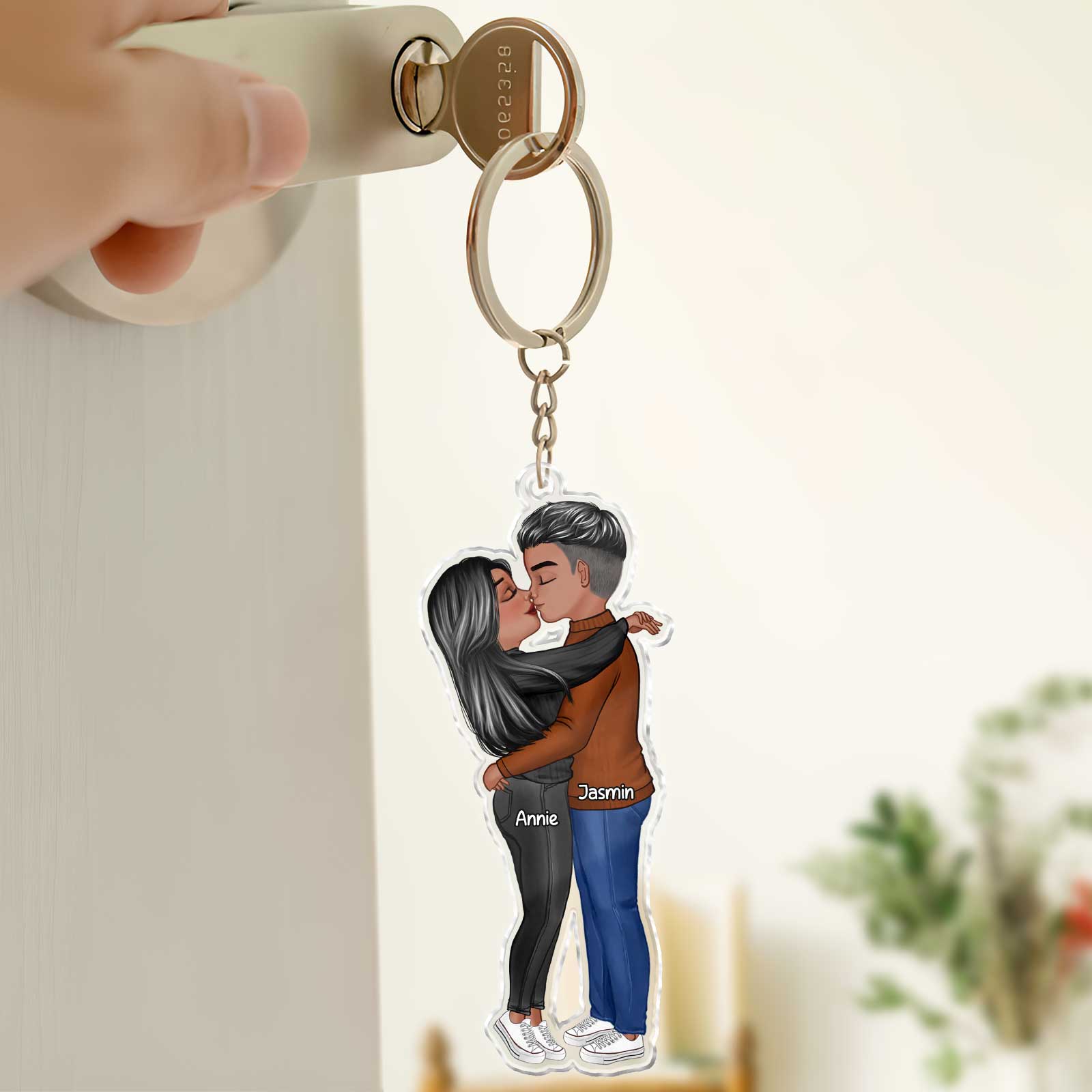 Personalized couple keychain featuring a couple embracing, ideal gift for anniversaries or sentimental moments