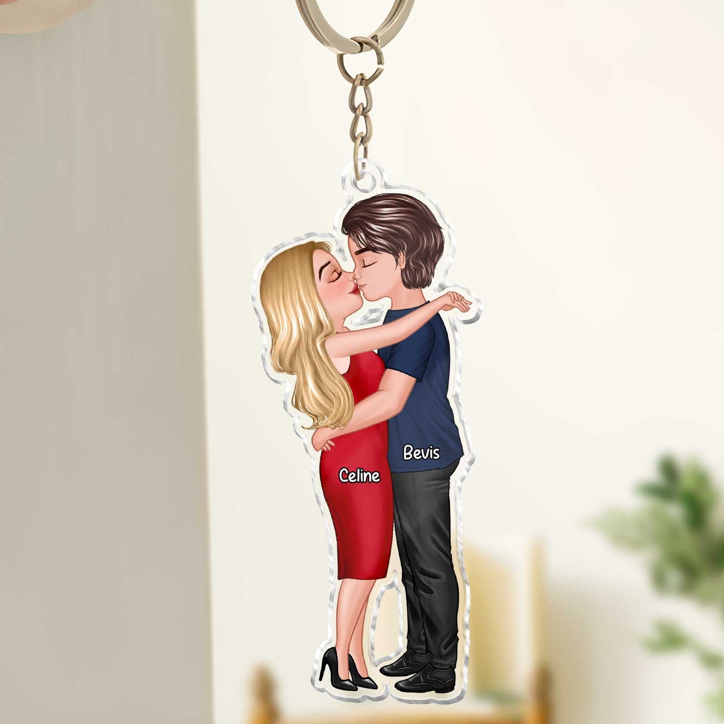 Personalized couple keychain featuring an illustrated couple embracing with custom names