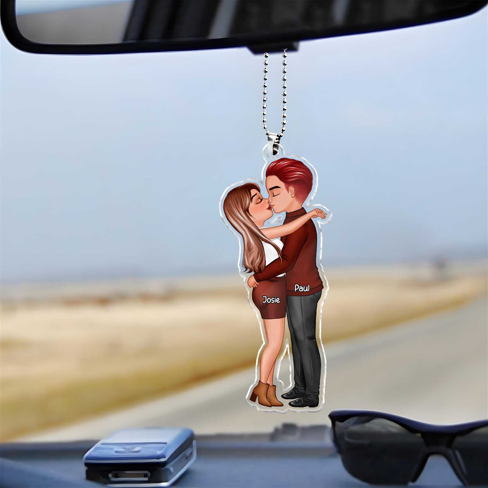 Personalized couple keychain featuring a cute couple kissing with names Josie and Paul