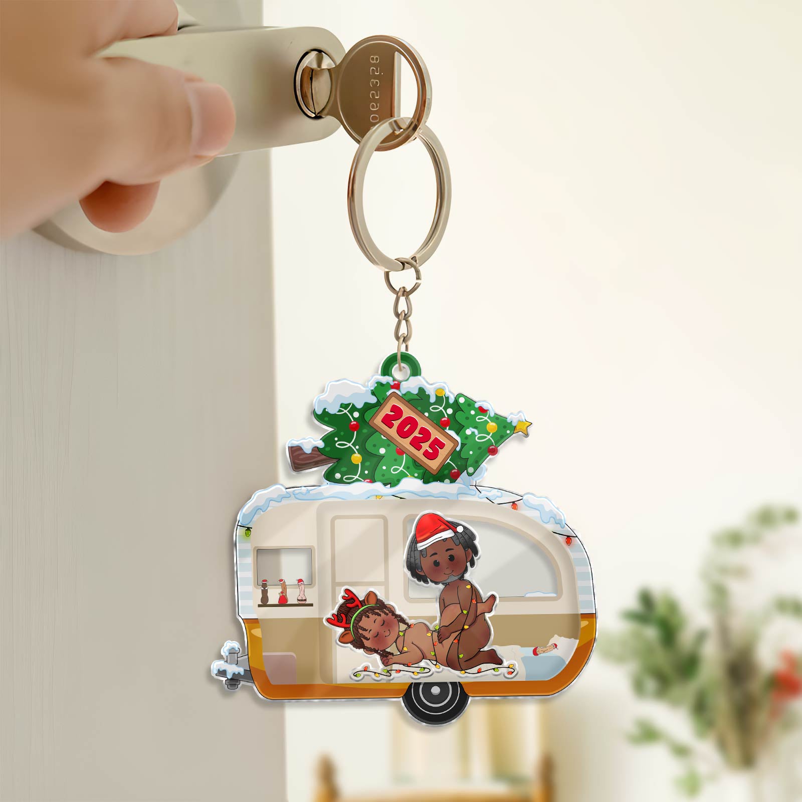Personalized couple keychain featuring a holiday-themed design with a vintage camper and festive decorations