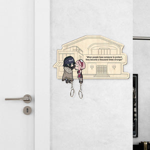 365Gifty personalized couple keychain with cartoon characters and motivational quote on wooden house background