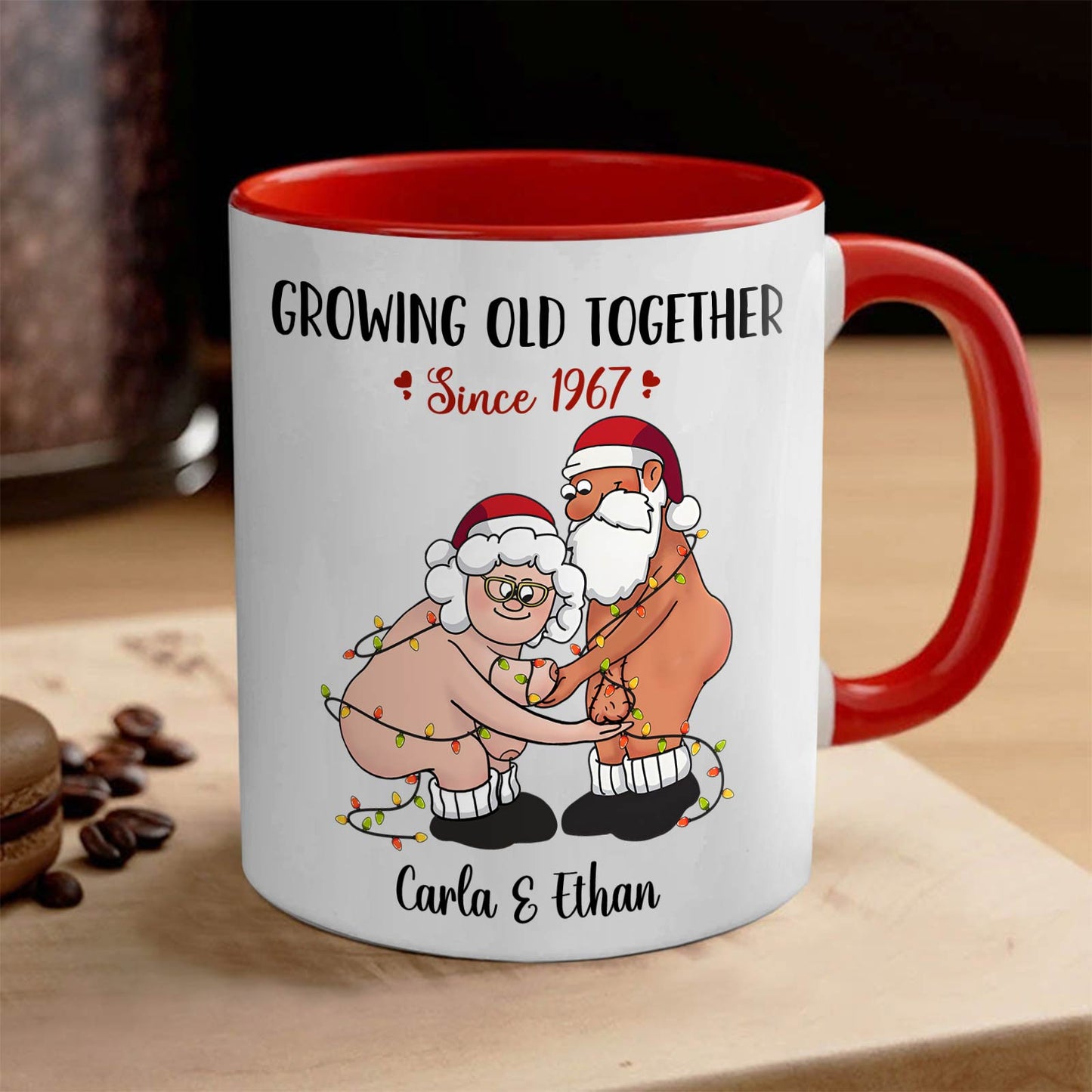 Personalized couple mug with cartoon elderly Santa and Mrs Claus wrapped in lights and custom names Carla and Ethan