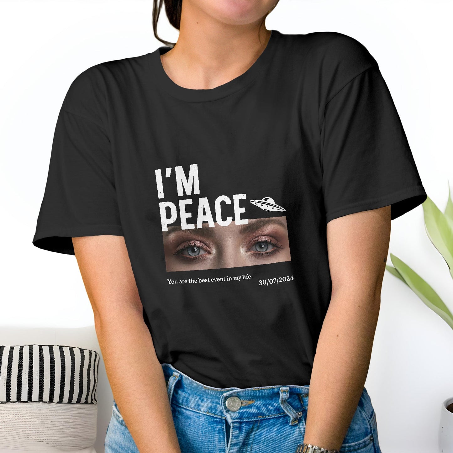 Black personalized couple t-shirt with I'm Peace text and eye graphic worn by woman with jeans