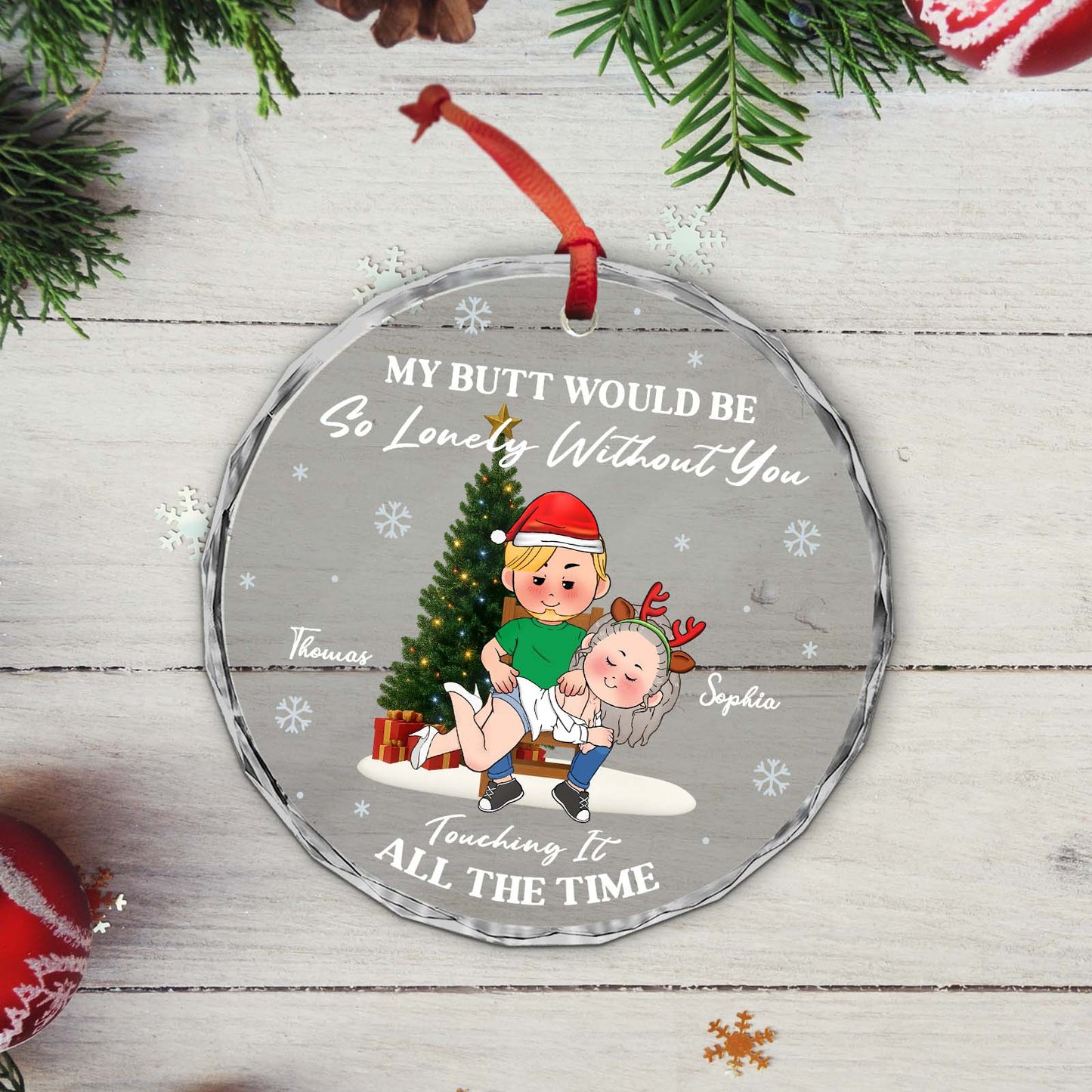 Personalized couples Christmas ornament featuring cartoon couple with festive design and playful text