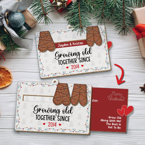 Personalized couples Christmas ornament with mitten design and custom names growing old together since 2014