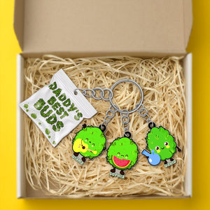 Cute personalized daddy keychain set with fun green characters in a gift box with straw