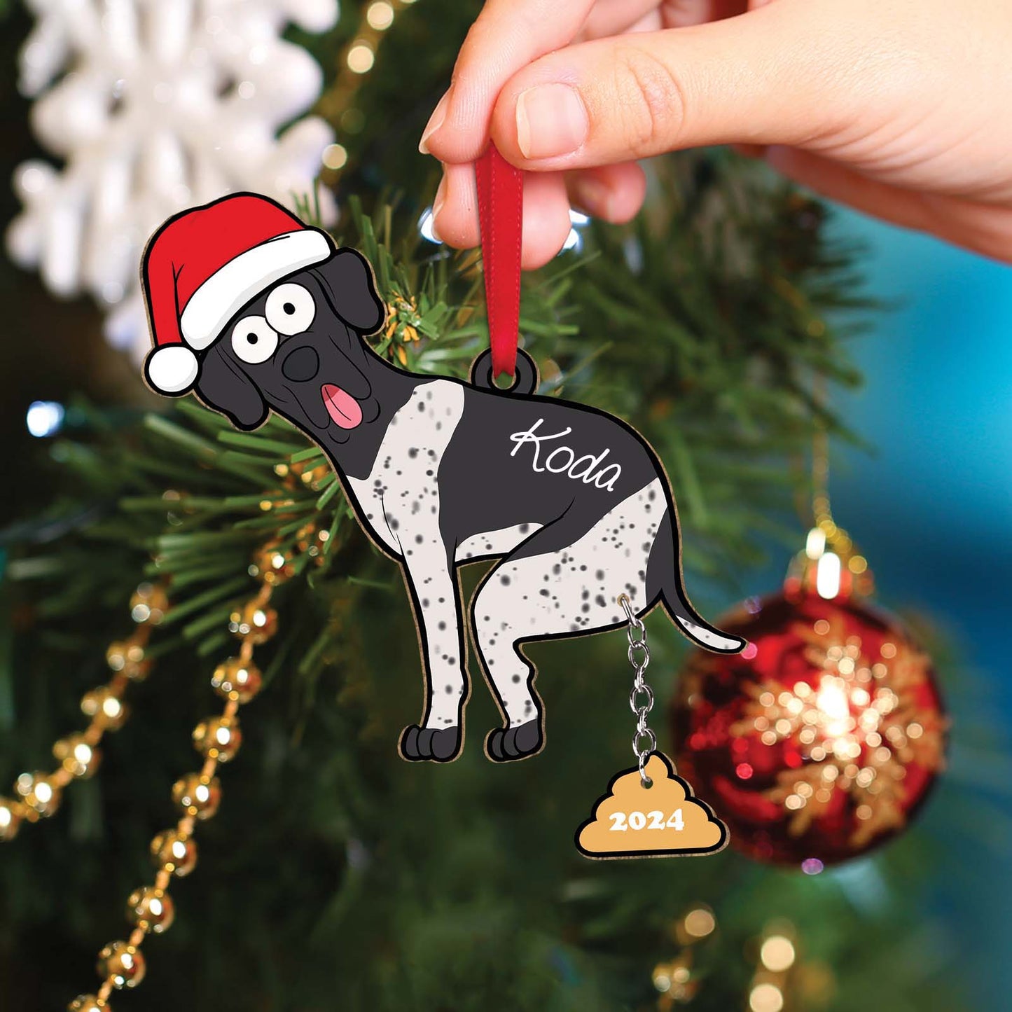 Personalized dog Christmas ornament featuring a black and white dog wearing a Santa hat with the name Koda and 2024 tag