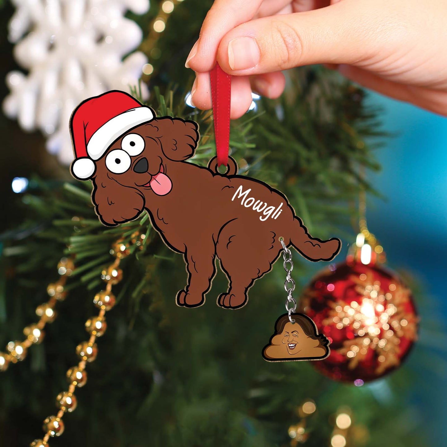 Personalized dog Christmas ornament shaped like a cartoon brown dog wearing a Santa hat with name Mowgli