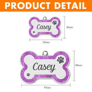 Personalized dog ID tag in bone shape with purple glitter and custom name for pet identification