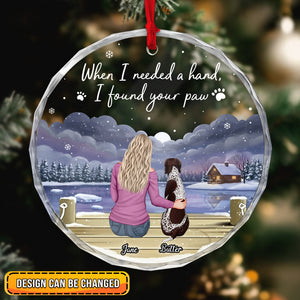 Personalized dog lover ornament featuring a woman with her dog by a lakeside cabin