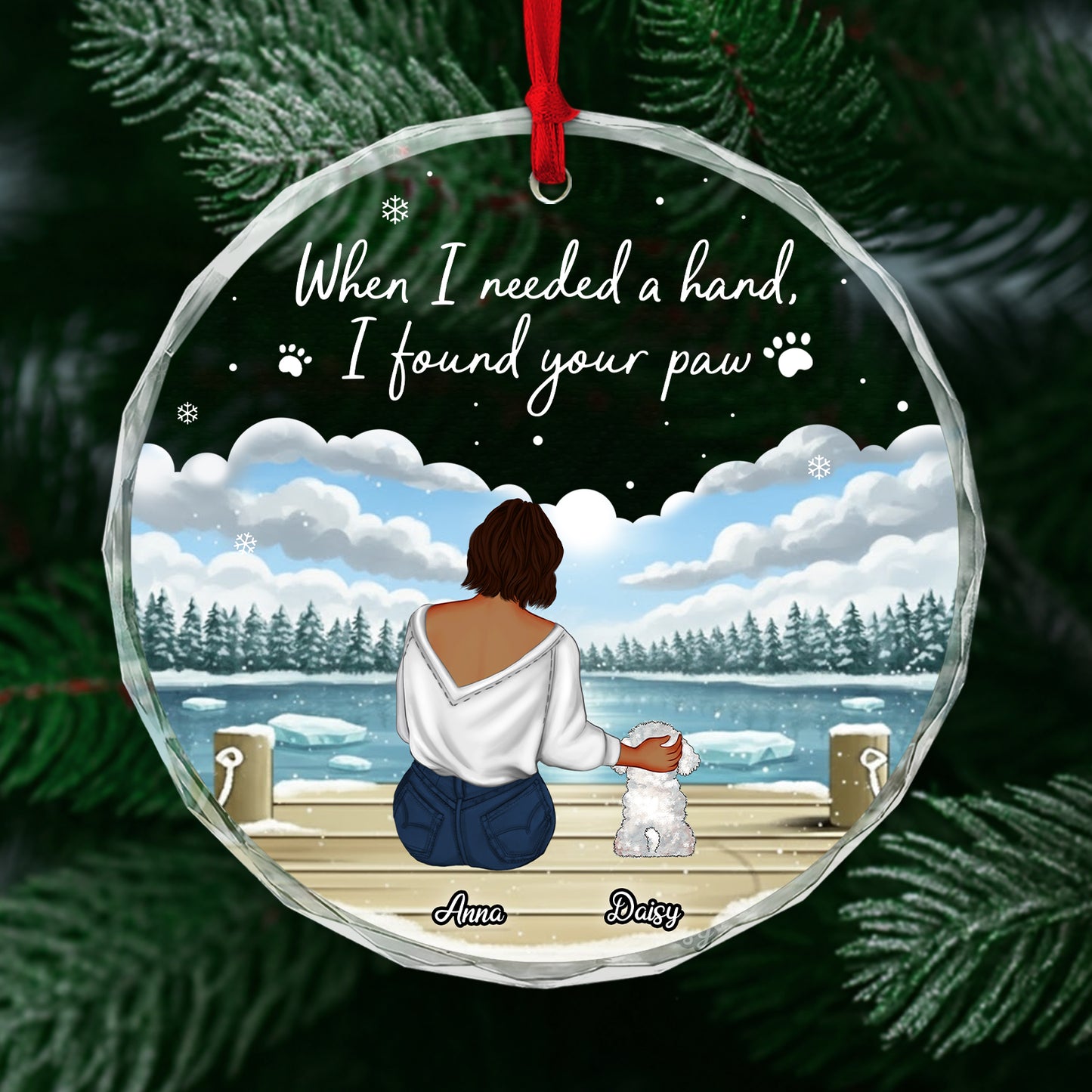 Personalized dog lover ornament featuring a woman sitting with her dog by a snowy lake