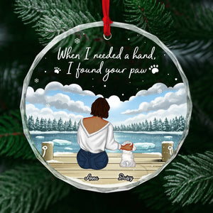 Personalized dog lover ornament featuring a woman sitting with her dog by a snowy lake