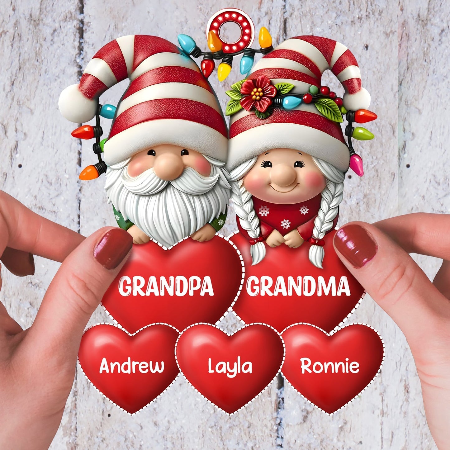 Personalized family Christmas ornament featuring cute gnomes holding red hearts with names for holiday cheer