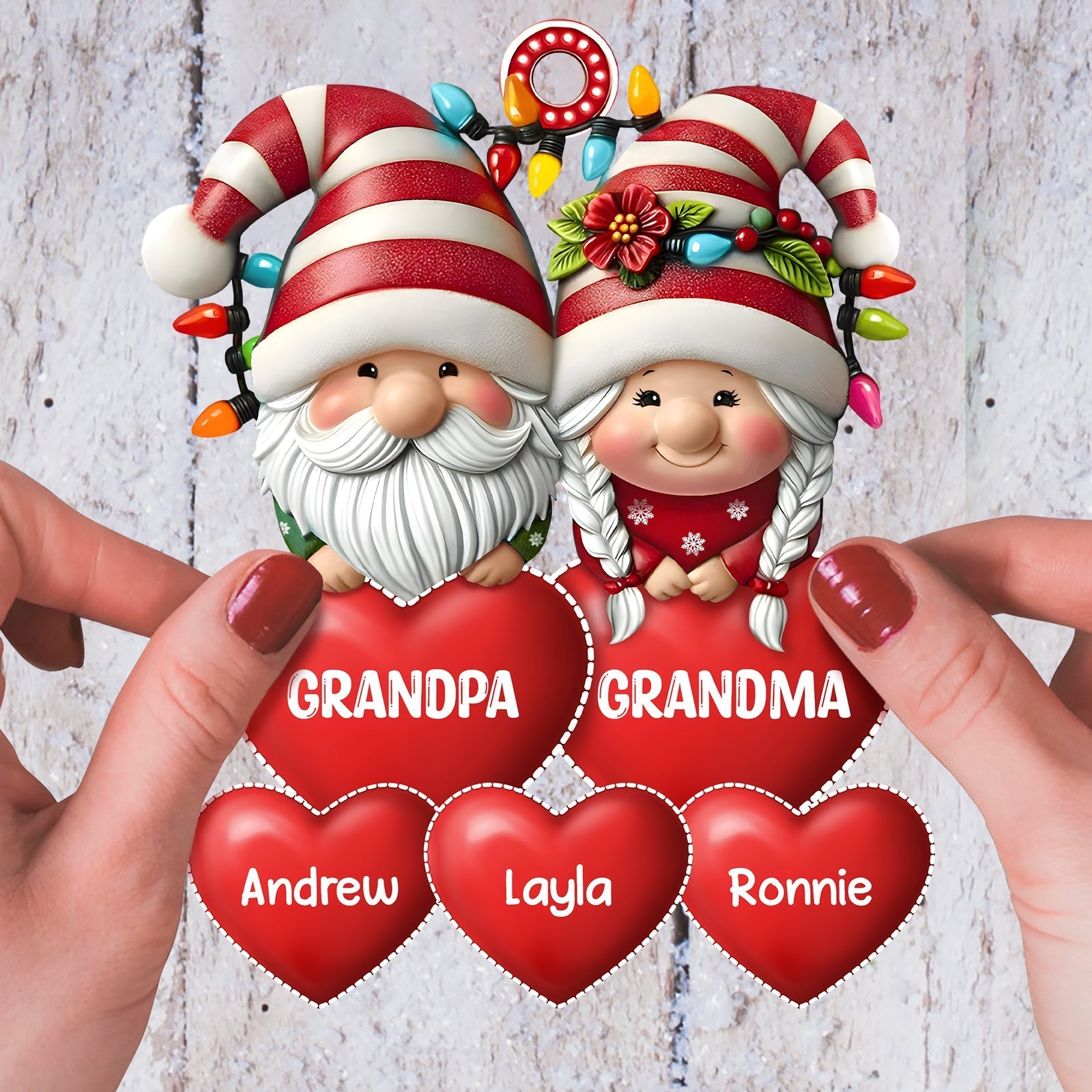 Personalized family Christmas ornament featuring cute gnomes holding red hearts with names for holiday cheer