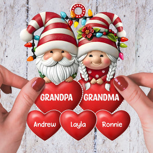 Personalized family Christmas ornament featuring cute gnomes holding red hearts with names for holiday cheer