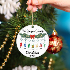 Personalized family Christmas ornament with names and stockings hanging on pine branch 2024